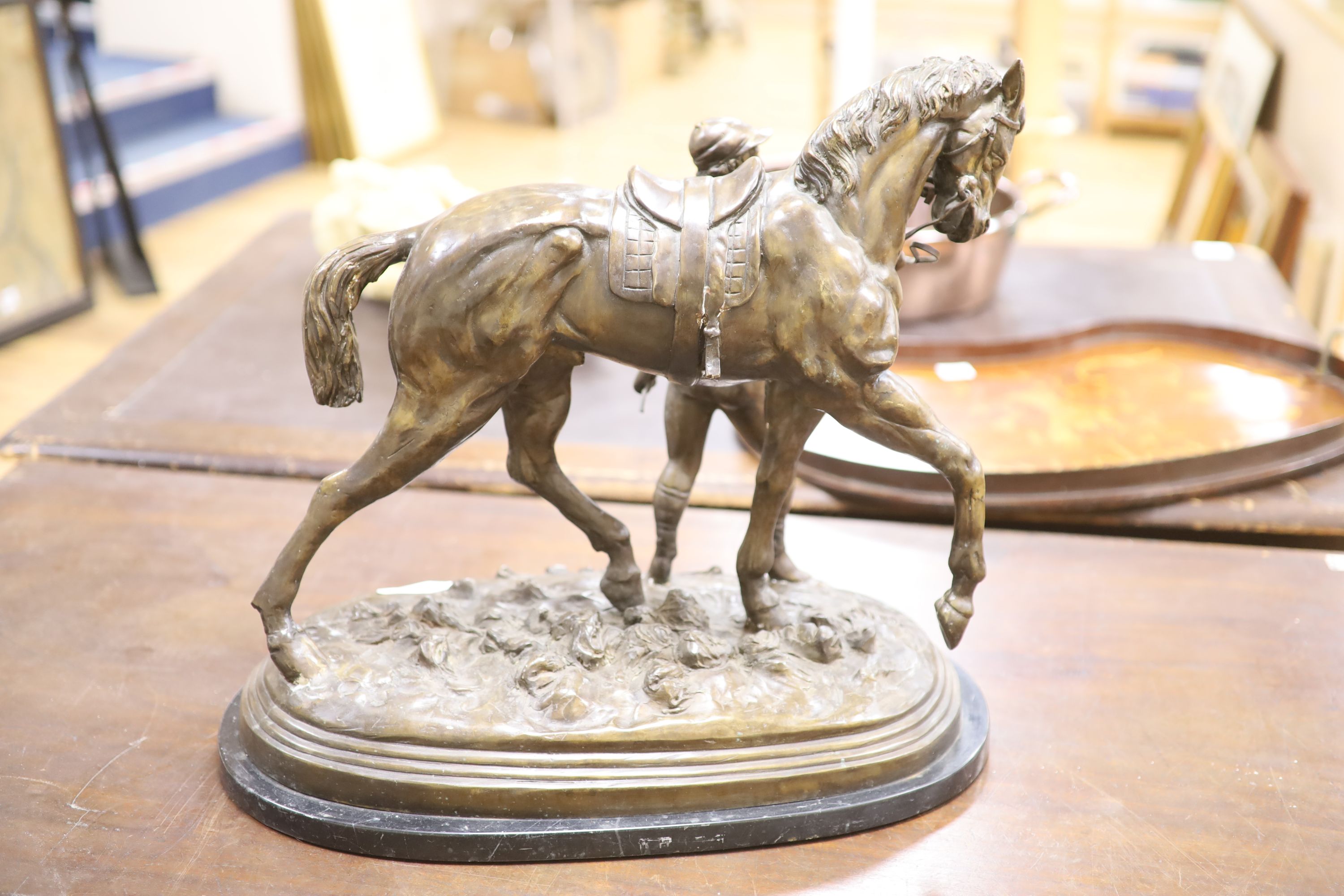 After Edgar Beetram. A large bronze horse and jockey, signed 1872, length 52cm